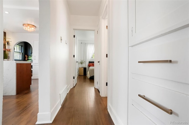 hallway featuring dark wood-type flooring