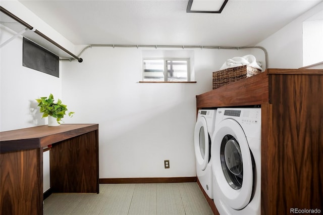 washroom with washer and dryer