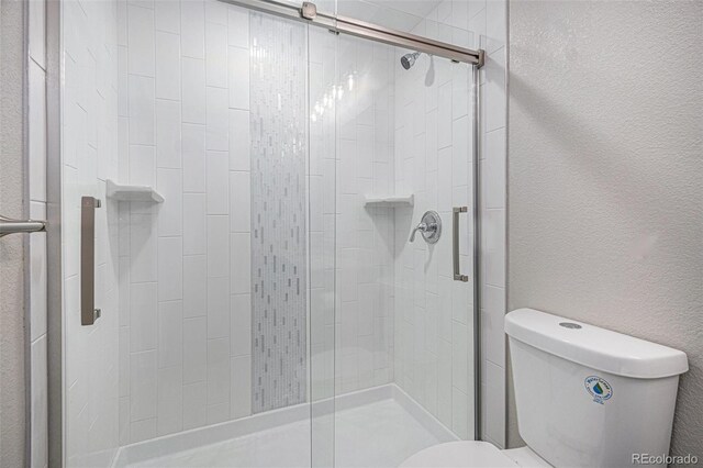1962 Canyonpoint Ln, Castle Pines, CO 80108 - full bath featuring a shower stall and a textured wall