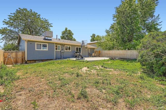 2615 S Laredo Ct, Aurora, CO 80013 - back of property with a patio and a fenced backyard