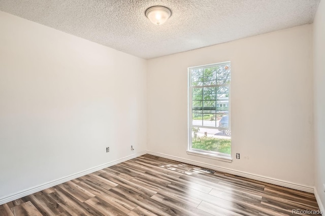 2615 S Laredo Ct, Aurora, CO 80013 - spare room with wood finished floors and a textured ceiling