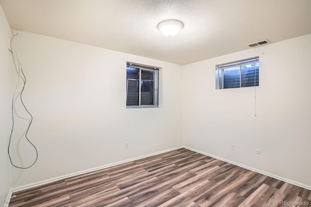 2615 S Laredo Ct, Aurora, CO 80013 - unfurnished room with wood finished floors and a textured ceiling