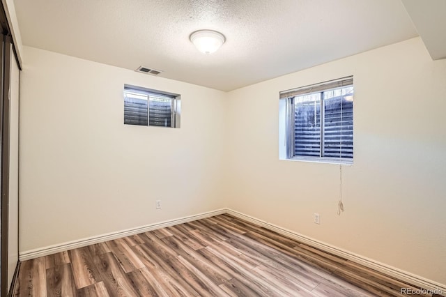 2615 S Laredo Ct, Aurora, CO 80013 - spare room with wood finished floors and a textured ceiling