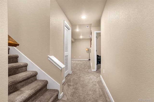 hall with carpet floors