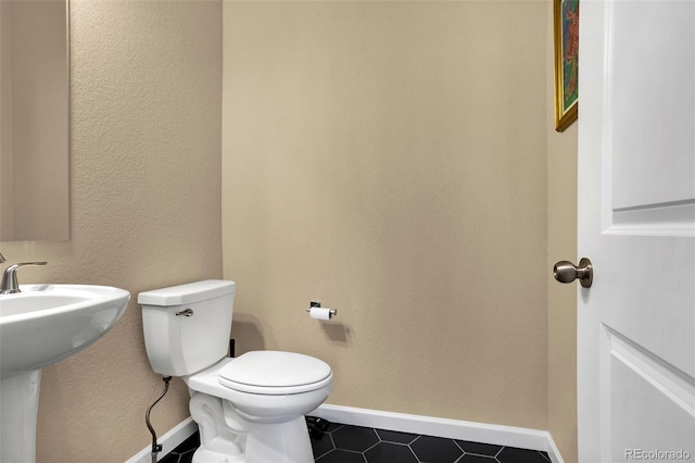 bathroom featuring toilet