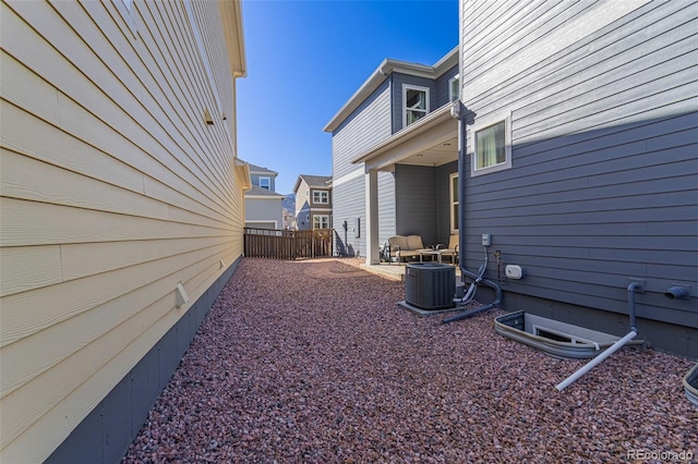 view of yard featuring cooling unit and a patio