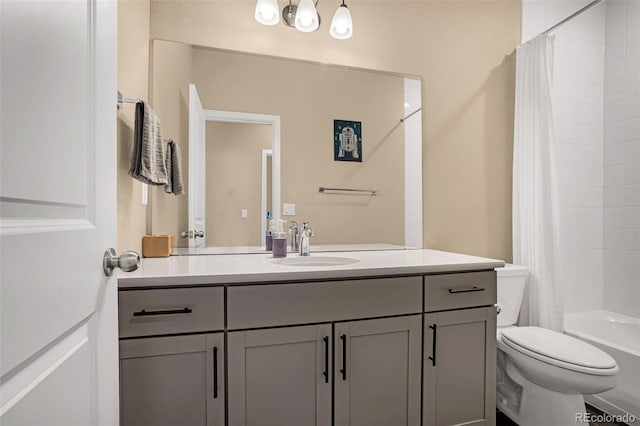 full bathroom featuring toilet, vanity, and shower / bath combo with shower curtain