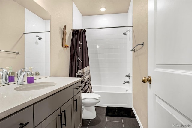 full bathroom with tile patterned floors, toilet, vanity, and shower / bath combo