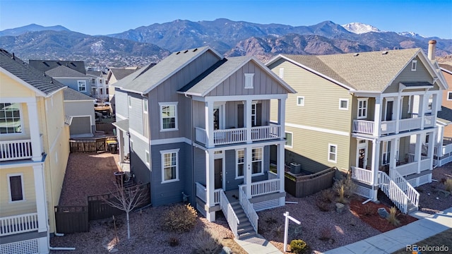 exterior space featuring a mountain view and central AC unit