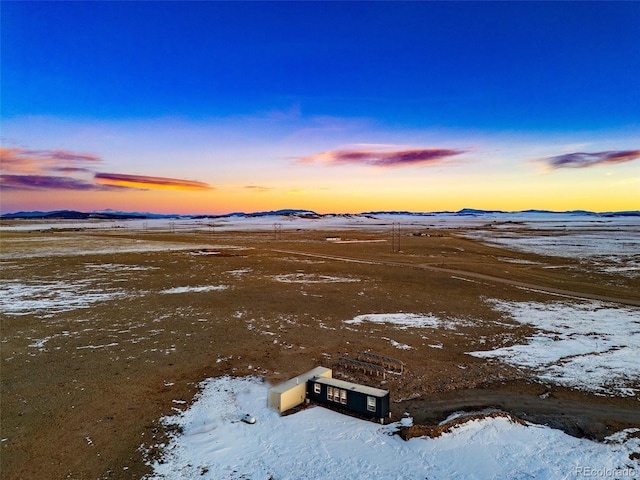 aerial view at dusk with a mountain view