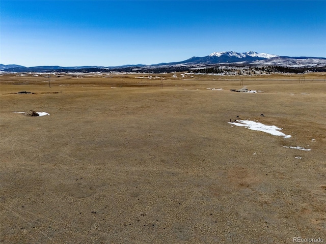 birds eye view of property featuring a rural view and a mountain view