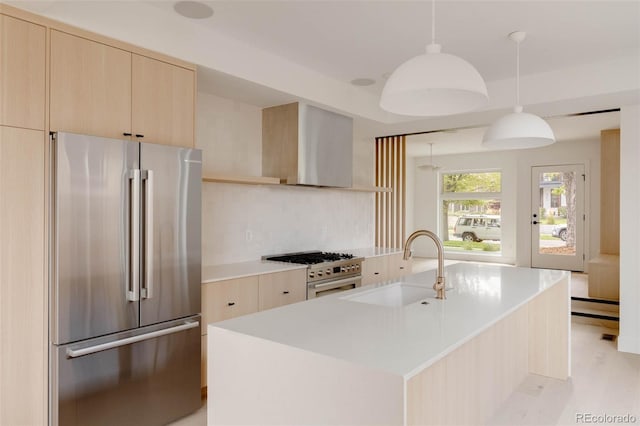 4322 Quivas St, Denver, CO 80211 - kitchen featuring freestanding refrigerator, range with gas stovetop, light brown cabinets, wall chimney exhaust hood, and a sink