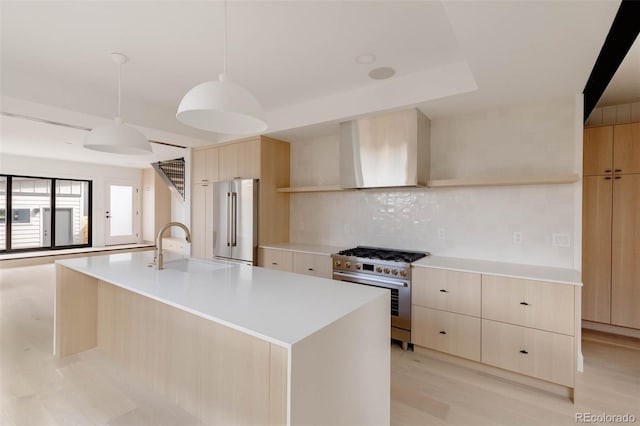 4322 Quivas St, Denver, CO 80211 - kitchen with premium appliances, modern cabinets, light brown cabinetry, and a sink