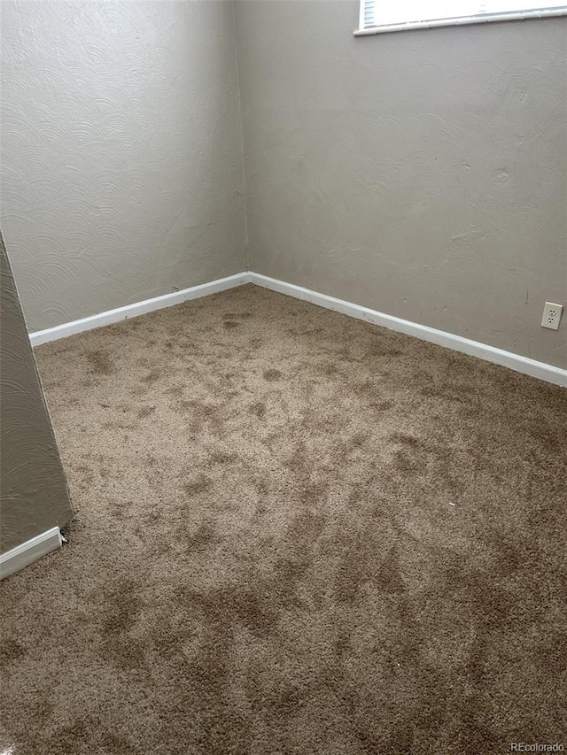 empty room with carpet flooring