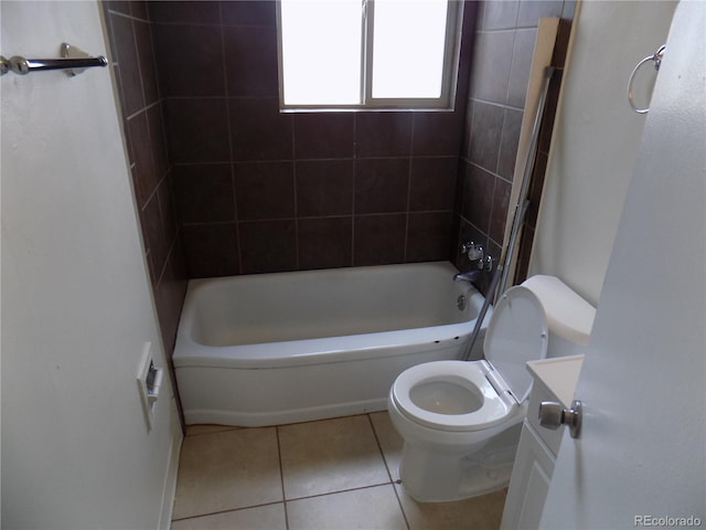 full bathroom with vanity, tiled shower / bath, tile patterned floors, and toilet