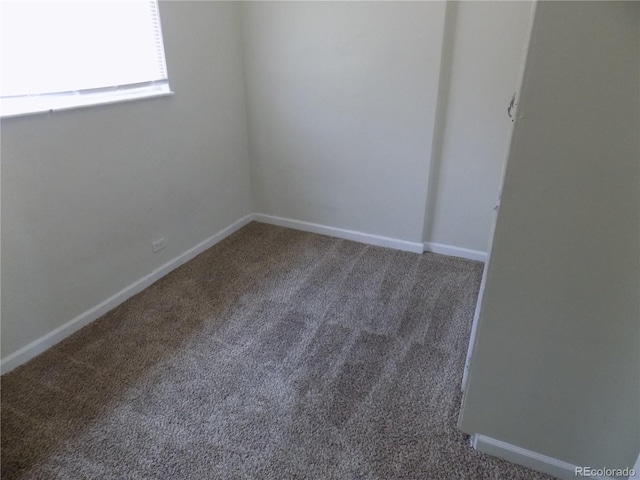 empty room featuring carpet flooring