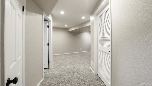 hallway with light carpet