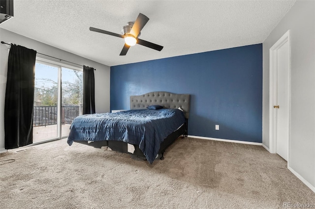 carpeted bedroom with access to outside, ceiling fan, and a textured ceiling