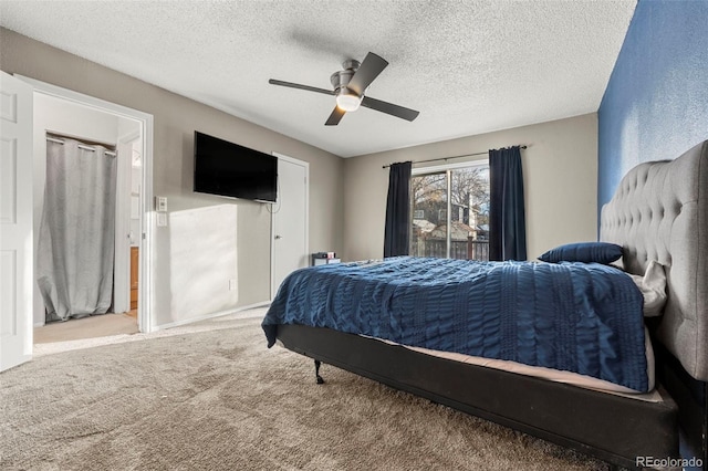 bedroom featuring carpet flooring, ceiling fan, and a textured ceiling