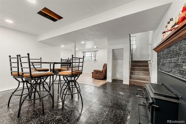 dining room with a textured ceiling