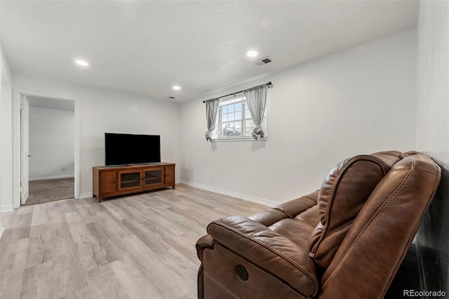 living room with light hardwood / wood-style floors