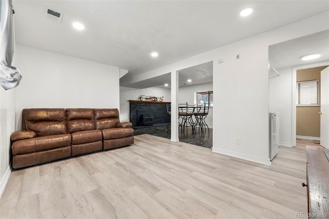 living room with light hardwood / wood-style floors