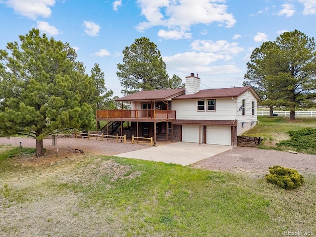 view of front of property featuring stairs, a deck, an attached garage, driveway, and a chimney