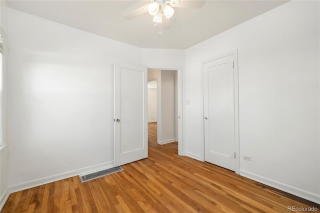 2570 Jay St, Edgewater, CO 80214 - unfurnished bedroom featuring light wood-type flooring, baseboards, and a ceiling fan