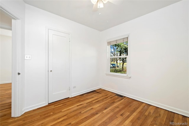 2570 Jay St, Edgewater, CO 80214 - unfurnished bedroom featuring light wood finished floors, baseboards, and ceiling fan