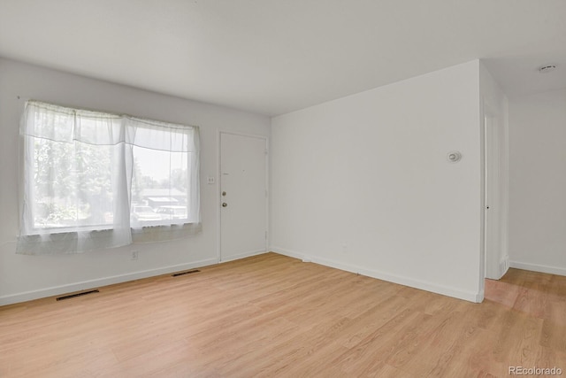 373 S Hazel Ct, Denver, CO 80219 - spare room with light wood-style floors and healthy amount of natural light