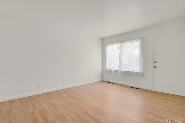 373 S Hazel Ct, Denver, CO 80219 - entryway with light wood finished floors
