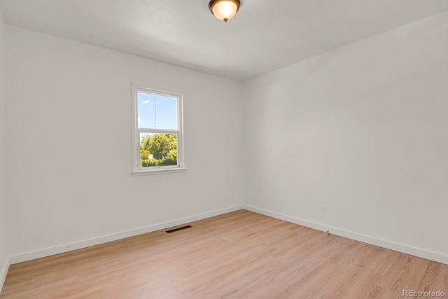 373 S Hazel Ct, Denver, CO 80219 - empty room with light wood-style floors and baseboards