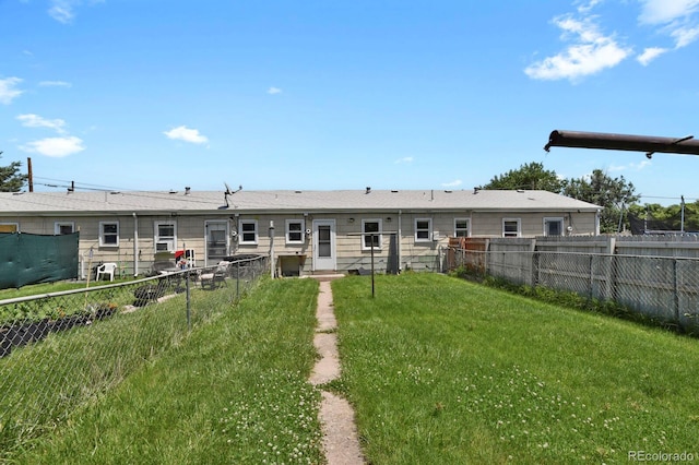 373 S Hazel Ct, Denver, CO 80219 - rear view of house with a fenced backyard