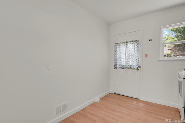 373 S Hazel Ct, Denver, CO 80219 - washroom featuring light wood-style floors and baseboards