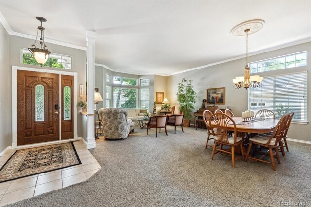 3145 Stevens Cir, Erie, CO 80516 - tiled dining space with a chandelier, ornamental molding, and carpet floors