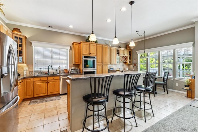 3145 Stevens Cir, Erie, CO 80516 - kitchen featuring stainless steel appliances, light tile patterned flooring, tasteful backsplash, recessed lighting, and crown molding