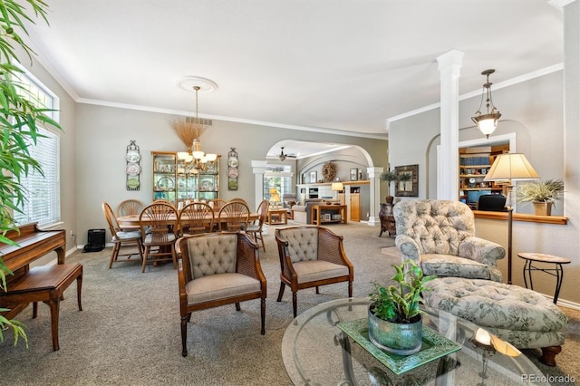 3145 Stevens Cir, Erie, CO 80516 - living room featuring carpet floors, crown molding, arched walkways, ornate columns, and a chandelier