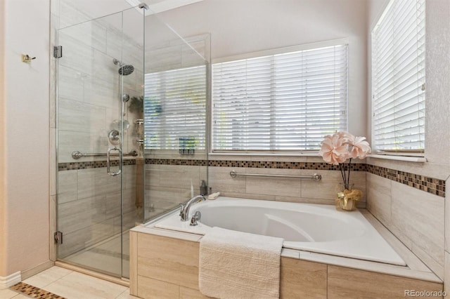 3145 Stevens Cir, Erie, CO 80516 - bathroom with a bath, a shower stall, and tile patterned floors