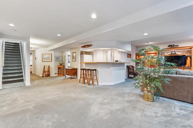 3145 Stevens Cir, Erie, CO 80516 - carpeted living room with stairs, a dry bar, and recessed lighting