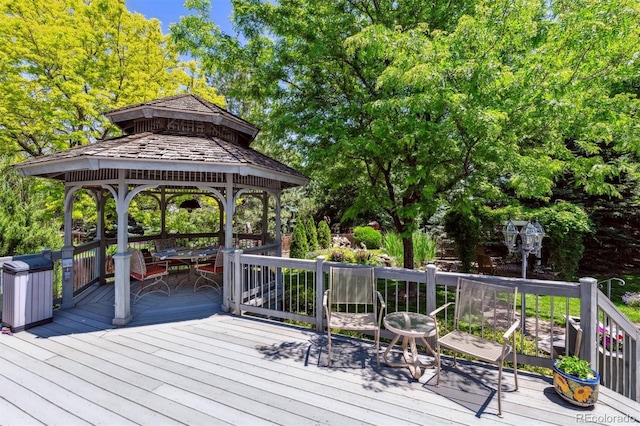 3145 Stevens Cir, Erie, CO 80516 - wooden deck featuring a gazebo and view of scattered trees