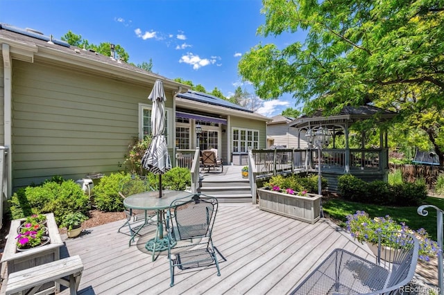 3145 Stevens Cir, Erie, CO 80516 - wooden terrace featuring outdoor dining area and a gazebo