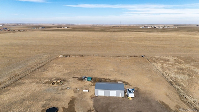 birds eye view of property featuring a rural view