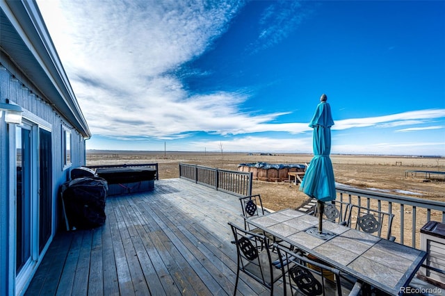 wooden terrace featuring a rural view