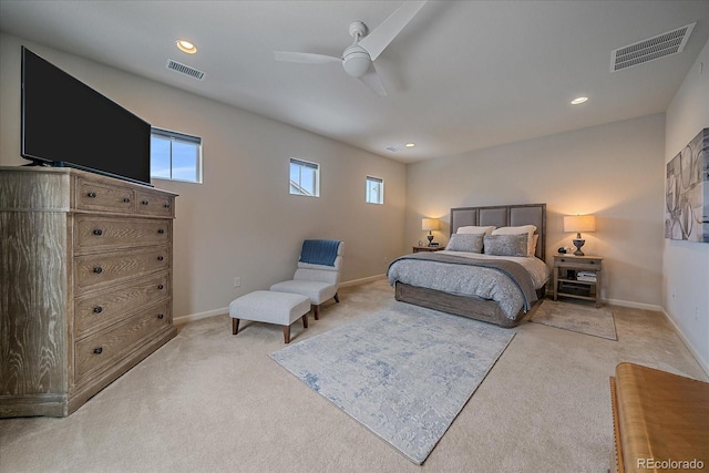 bedroom featuring light colored carpet and ceiling fan