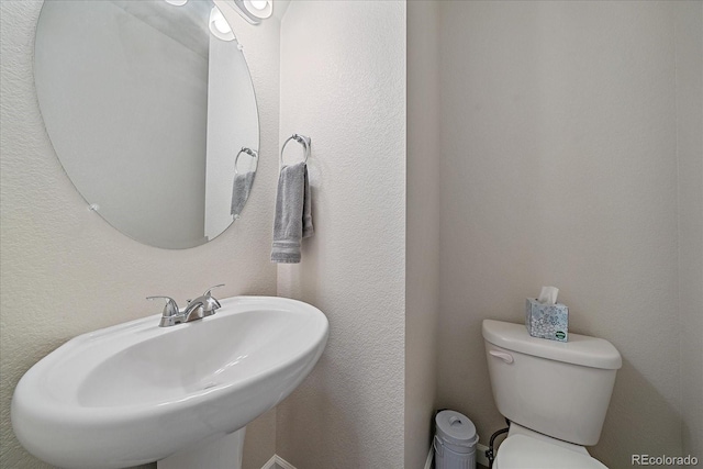 bathroom with sink and toilet