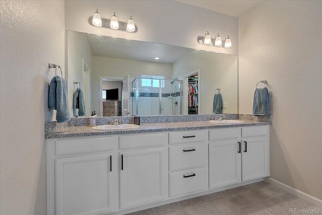 bathroom featuring vanity and walk in shower