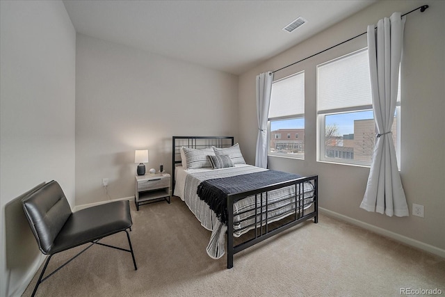 bedroom featuring light colored carpet