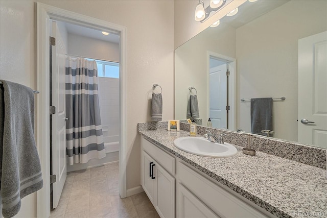 bathroom with vanity and shower / bath combo