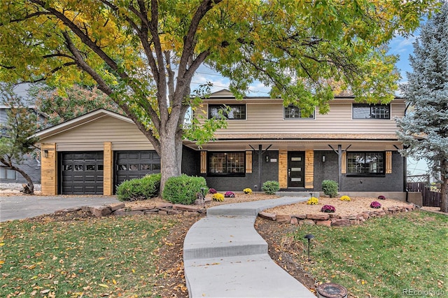 view of front facade with covered porch and a garage