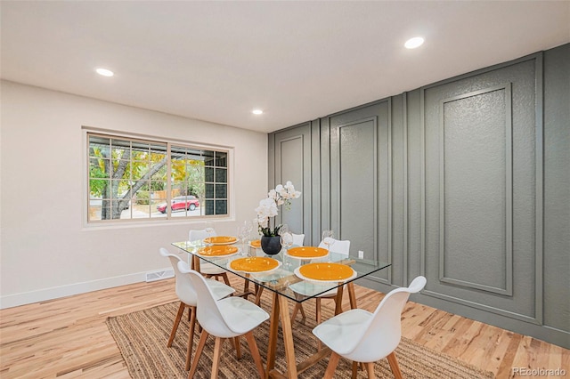 dining room with light hardwood / wood-style floors